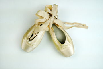 Ballet pointe shoes on a white background. View from above.