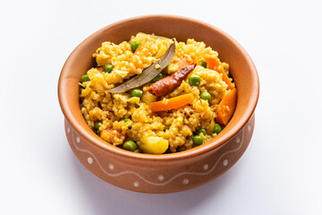 Bengali dish khichdi or khichuri made from a combination of lentils and rice and vegetables