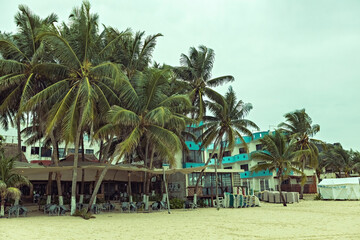 Obraz premium Beach hotel at Playa del Carmen, seaview villa on cloudy day before the rain, Playa del Carmen, Mexico
