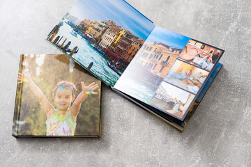 Fototapeta na wymiar Photobook Album with Travel Photo on Table
