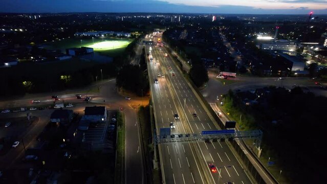 Aerial View of British Motorways With Fast Moving Traffic at Peak Time. M1 J11 and  J7 Motorways Junction Interchange. Time Lapse Shot captured on 7th Sep 2022