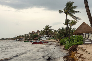 Boats on the water, stormy sea in Playa del Carmen, Mexico