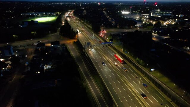 Aerial View of British Motorways With Fast Moving Traffic at Peak Time. M1 J11 and  J7 Motorways Junction Interchange. Time Lapse Shot captured on 7th Sep 2022