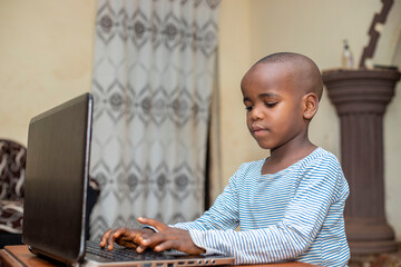 African American male Student Browsing E-Learning Website On Computer, Doing Homework In Internet, Black Teen Schoolboy Study Remotely studying With Laptop At Home