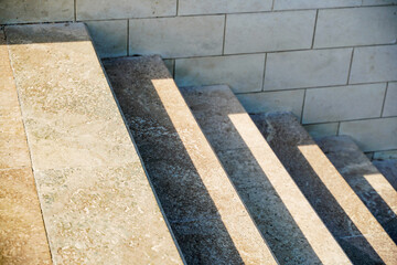 Staircase in the city, black and white pattern on the stairs on a sunny day.