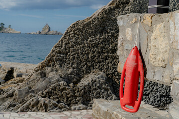 Rescue float. The lifeboat is hanging on the wall.