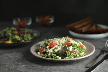 Delicious carrot salad served on grey table