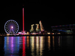 Night view of a seasonal theme park (Holyday Park) viewed across West Oder River