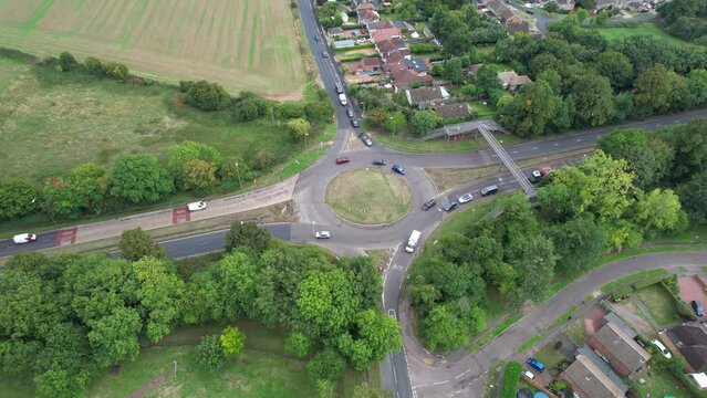 Aerial View of British Motorways With Fast Moving Traffic at Peak Time. M1 J11 and  J7 Motorways Junction Interchange. Time Lapse Shot captured on 7th Sep 2022