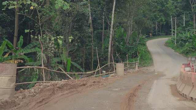 Detours to repair broken roads road signs, detours, road repairs and asphalt cracks in the mountains from rainwater.