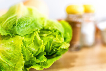 Close up fresh lettuce leaf on table.