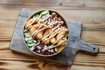 View from above of torpedo shrimp salad take-away bowl