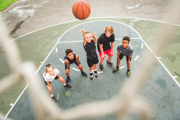 great child Team in sportswear playing basketball game - Powered by Adobe