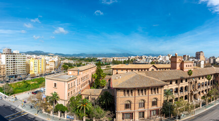 Fototapeta na wymiar High view of the Sky line of Palma de Mallorca with mountain views, blue sky 