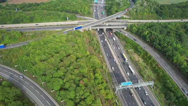 Aerial View of British Motorways With Fast Moving Traffic at Peak Time. M1 J11 and  J7 Motorways Junction Interchange. Time Lapse Shot captured on 7th Sep 2022