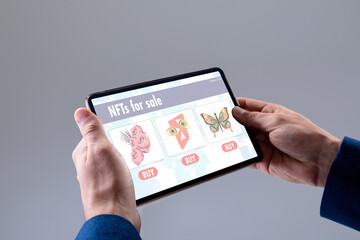 Caucasian businessman using tablet with data processing