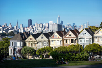Scenic view over the historic houses on the hillside in the foreground from Alamo Square in San Francisco to the skyline downtown.