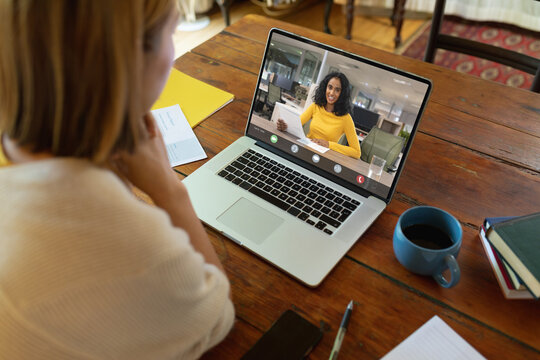 Asian businesswoman having video call with colleague