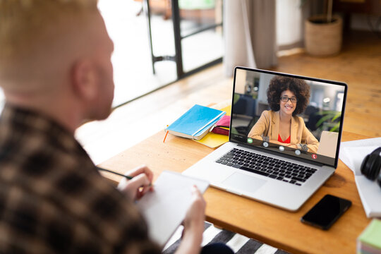 Albino african american businessman having video call with colleague