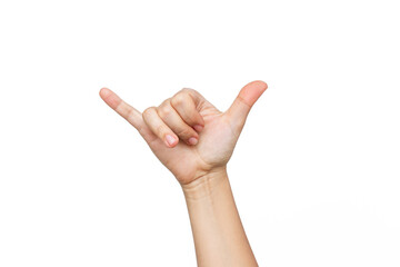 Female hand showing two fingers signifying the shaka gesture isolated on a white background....