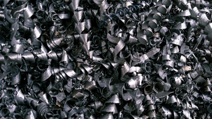 Steel scrap materials recycling. Aluminum chip waste after machining metal parts on a cnc lathe....