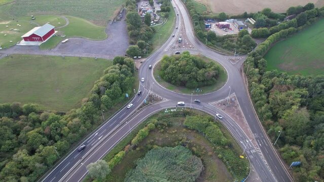 Aerial View of British Motorways With Fast Moving Traffic at Peak Time. M1 J11 and  J7 Motorways Junction Interchange. Time Lapse Shot captured on 7th Sep 2022