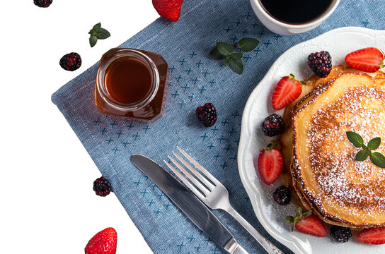 pankakes with berries, honey and coffee