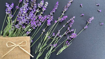lavender on a gray background in a burlap bag