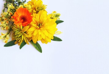 A bouquet of yellow flowers on a white background. Festive flower arrangement. Background for a greeting card.