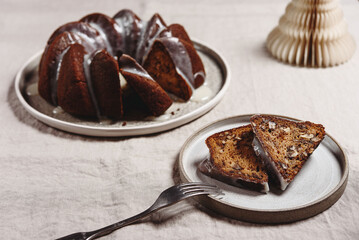 Pumpkin tangerine bundt cake with pumpkin spice and nuts for winter dinner. Christmas. Selective focus