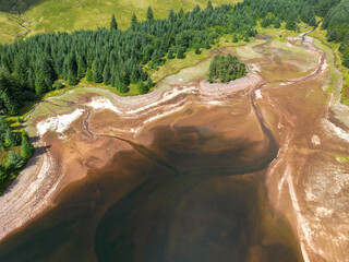Aerial view of very low water level in a reservoir due to a summer drought
