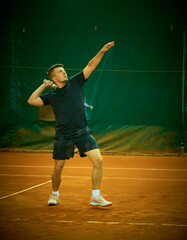 athlete trains on the court to play tennis