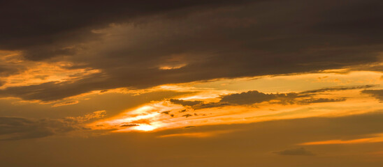 Fototapeta na wymiar Golden cloudy sky background