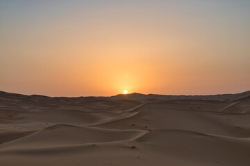 Fototapeta na wymiar Dunes in the Sahara desert at sunrise, the desert near the town of Merzouga, a beautiful African landscape