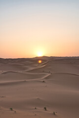 Obraz na płótnie Canvas Dunes in the Sahara desert at sunrise, the desert near the town of Merzouga, a beautiful African landscape