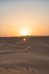 Dunes in the Sahara desert at sunrise, the desert near the town of Merzouga, a beautiful African landscape