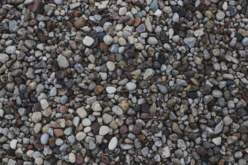 Textured background of stones, stone texture of different colors and shapes