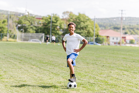 happy multicultural hispanic soccer player outdoor in sunny day
