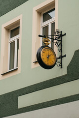Vintage Clock on The Side of a European Building - 529255035