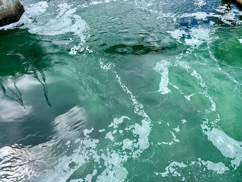 an unusual picture of bubbling water in a funnel is being pulled down as if the Bermuda Triangle Green Water it seems that I have mermaids very mystical but a beautiful place can be in any tropical