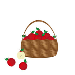 Rustic wicker basket full of  ripe red apples with green leaf and half of apple on white background with copy space.