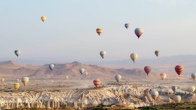 Balloons fly in Cappadocia, Turkey. Balloon in the sky aerial view. Hot air balloon flight.