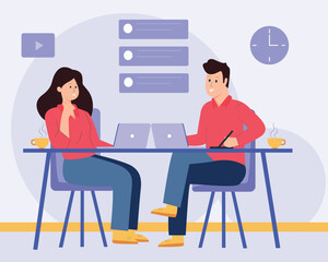 Team working on laptop in open office space.