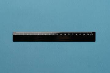 twenty centimeters black ruler isolated on pastel background