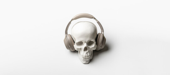 halloween holiday creative concept, white skull in headphones listening to music