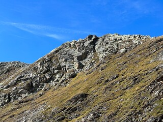 Fototapeta na wymiar Rocks and stones of the Silvretta Alps and Albula Alps mountain range in the Swiss Alps massif, Davos - Canton of Grisons, Switzerland (Kanton Graubünden, Schweiz)