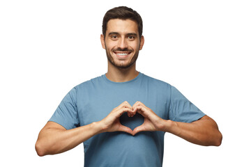 Young smiling handsome smiling male in blue t-shirt showing heart sign isolated