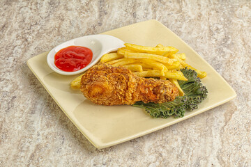 Crispy chicken leg with fry potato