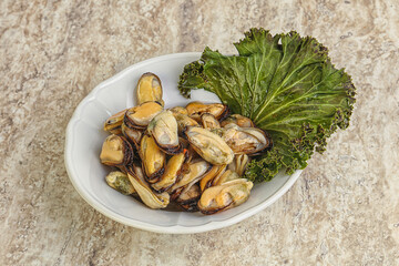 Tasty marinated mussels in the bowl