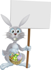White Easter rabbit holding sign